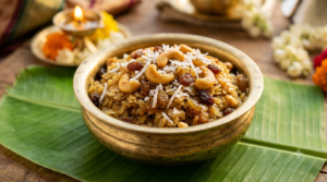 Atukula Prasadam Recipe Ingredients sweet poha with jaggery, cashews and raisins in a brass bowl