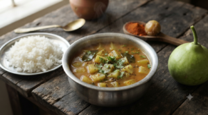 Lauki sambar recipe simmering in a steel pot with soft bottle gourd cubes, toor dal and a curry leaf tempering