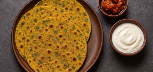 Gujarati Methi Thepla served with yogurt and pickle on an earthen plate