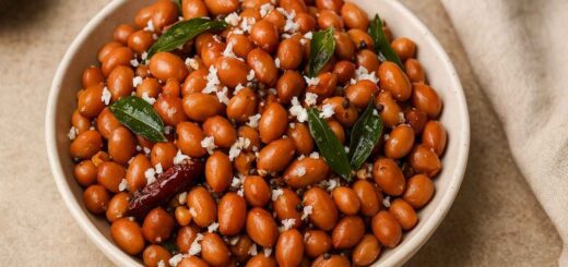 “Peanut Sundal recipe in a ceramic bowl with curry leaves and grated coconut – South Indian vegetarian snack”