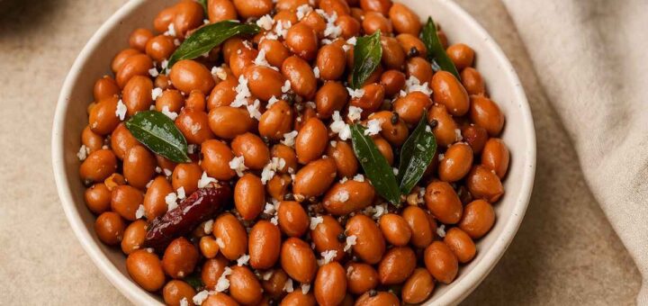 “Peanut Sundal recipe in a ceramic bowl with curry leaves and grated coconut – South Indian vegetarian snack”