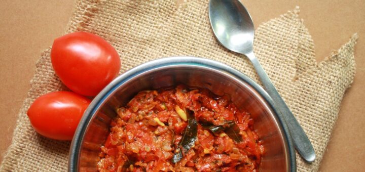 Tomato Kurma Coconut Milk creamy curry served in bowl.